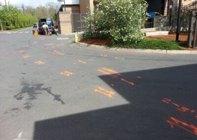 An empty driveway with orange markings.
