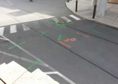 An empty driveway with orange and blue markings.