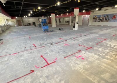 An empty floor space with orange markings on the floor.