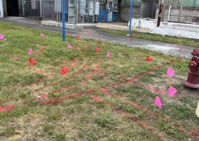 An empty ground with orange flag markings and arrows.