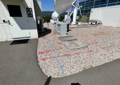 An electrical site with orange arrow markings on the ground.