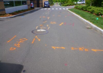 An empty driveway with orange markings.