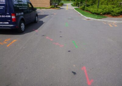 An empty driveway with orange and blue markings.